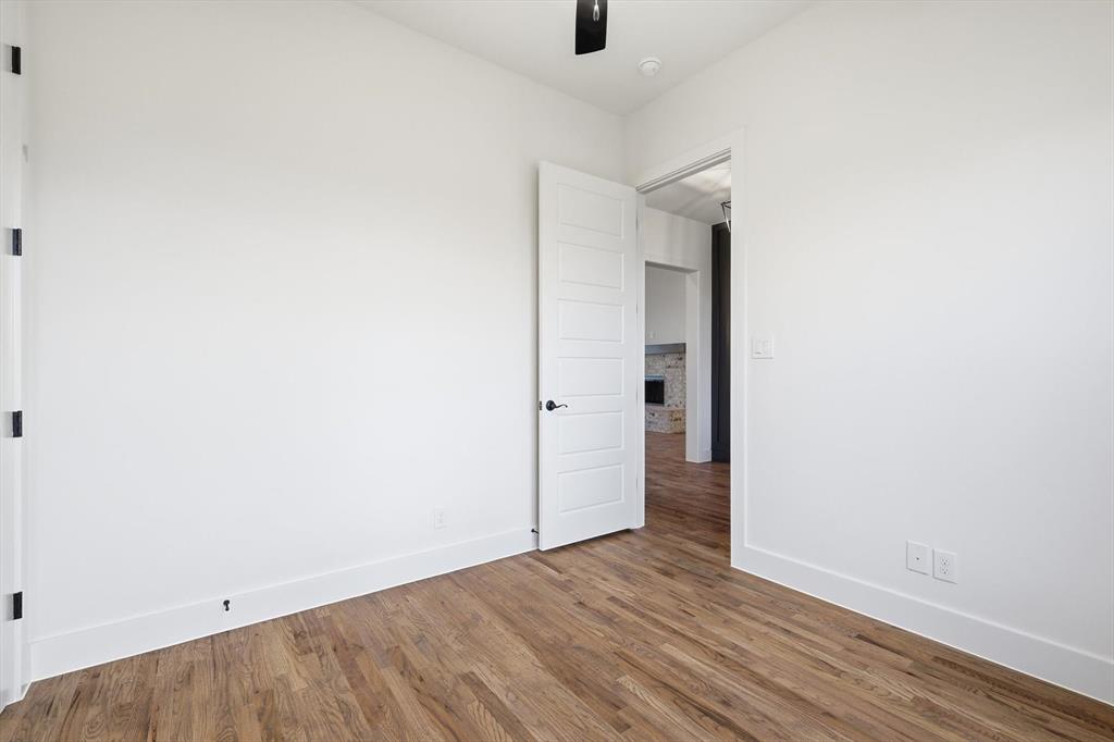 6412 Rigel Road Godley, TX 76044 - Photo 7 of 38 a view of an empty room with wooden floor