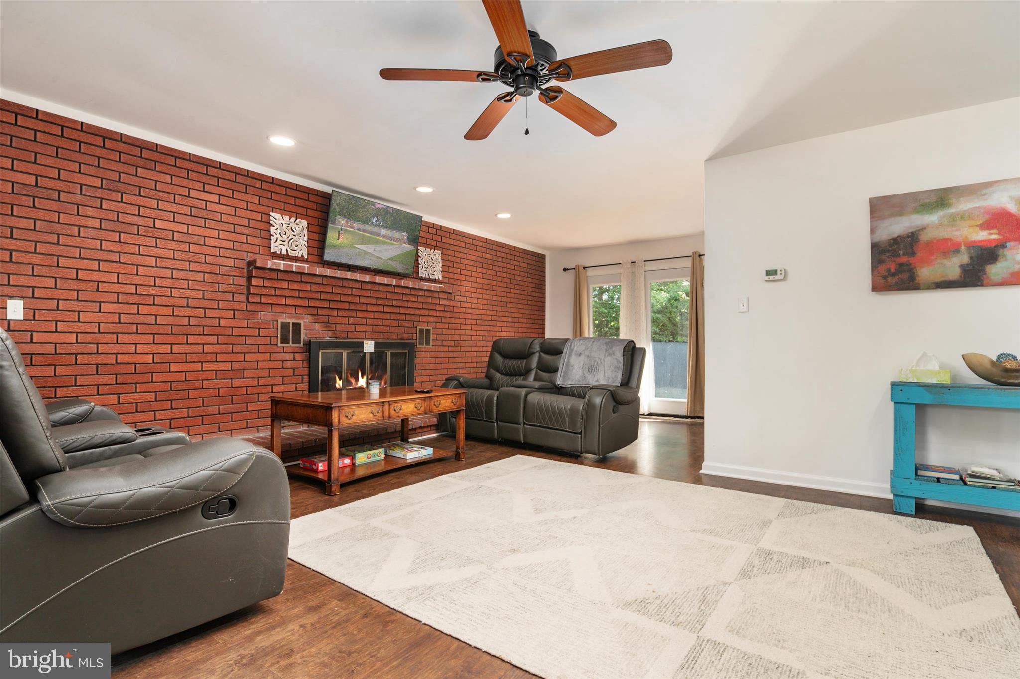 108 Wilson Road Grasonville, MD 21658 - Photo 28 of 38 a living room with furniture and a flat screen tv