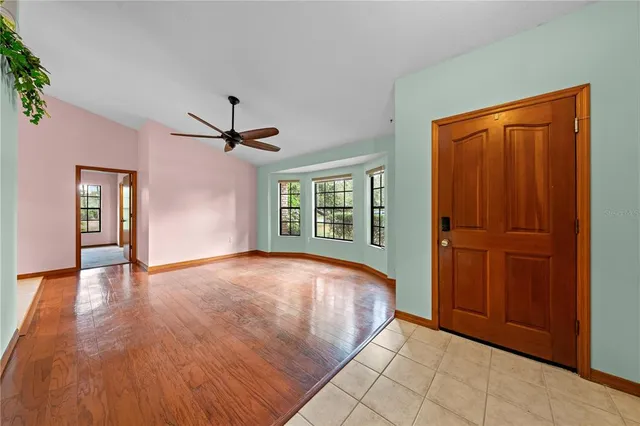a view of living room with furniture and window