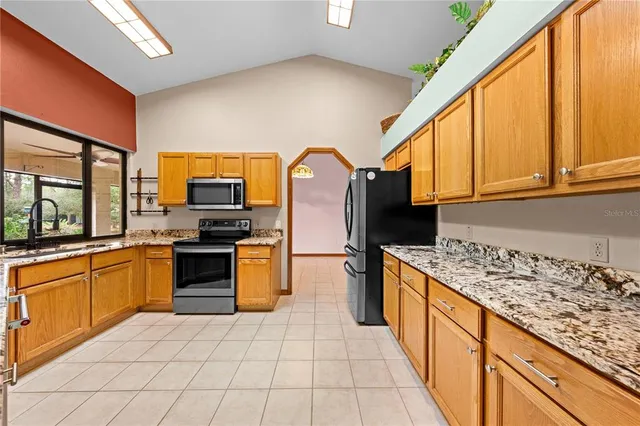 a bathroom with a tub mirror and window