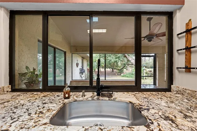 a bathroom with a sink a mirror and a shower