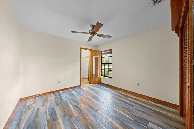 a very nice looking room with a large window and a table