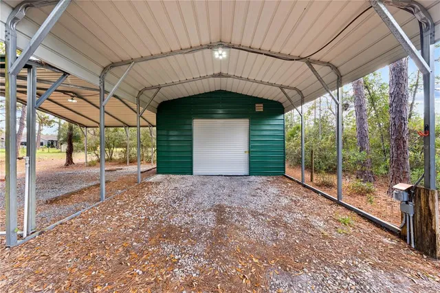 a house with swimming pool in front of it