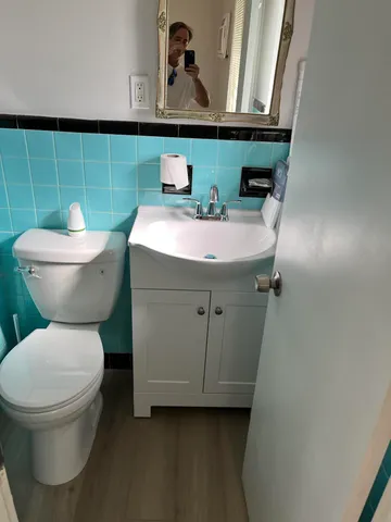 a bathroom with a toilet and a sink