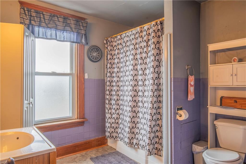 210 Wallula Avenue Butler, PA 16001 - Photo 21 of 33 a bathroom with a toilet and a shower curtain