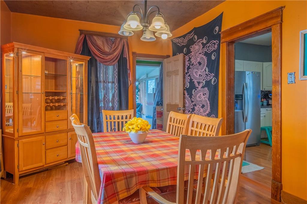 210 Wallula Avenue Butler, PA 16001 - Photo 8 of 33 a view of a dining room with furniture wooden floor and chandelier