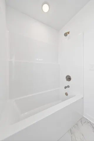 a bathroom with a bathtub