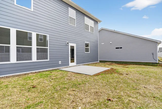 a bathroom with a granite countertop window and a shower