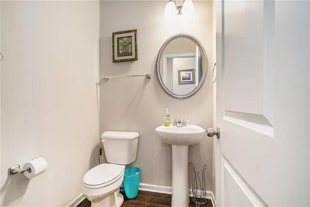 a bathroom with a toilet and a sink