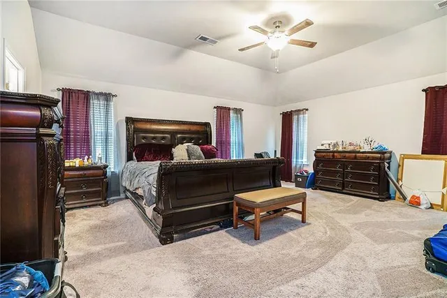 a bedroom with a bed and furniture