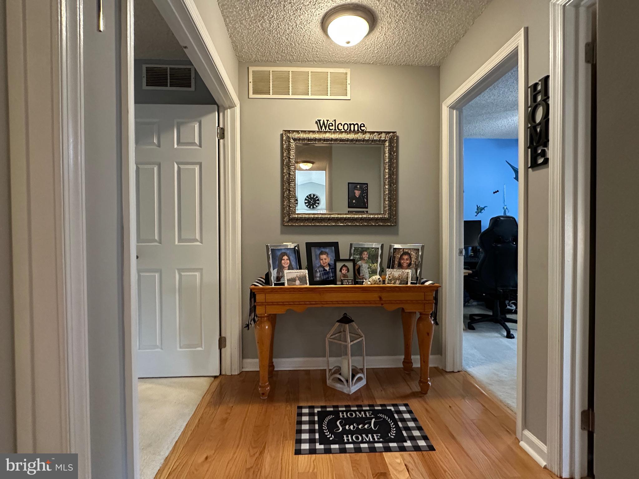 4 Sylvan Court Clementon, NJ 08021 - Photo 29 of 55 a view of a hallway with wooden floor and a window