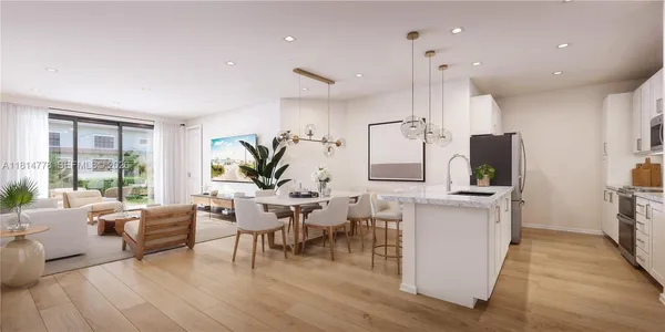 a living room with furniture a large window and wooden floor