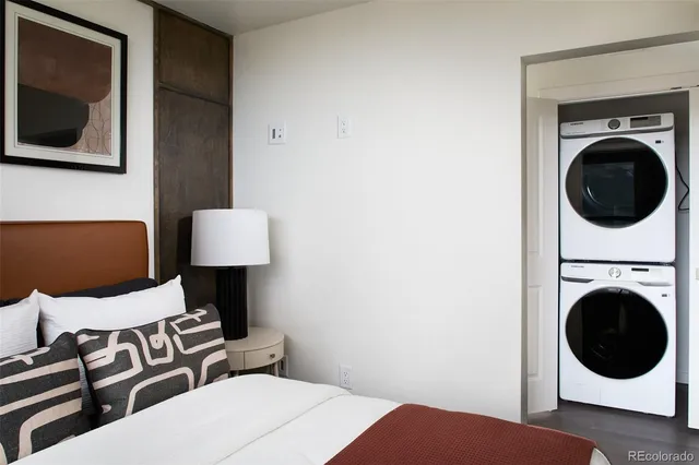 a view of a bedroom with washer and dryer