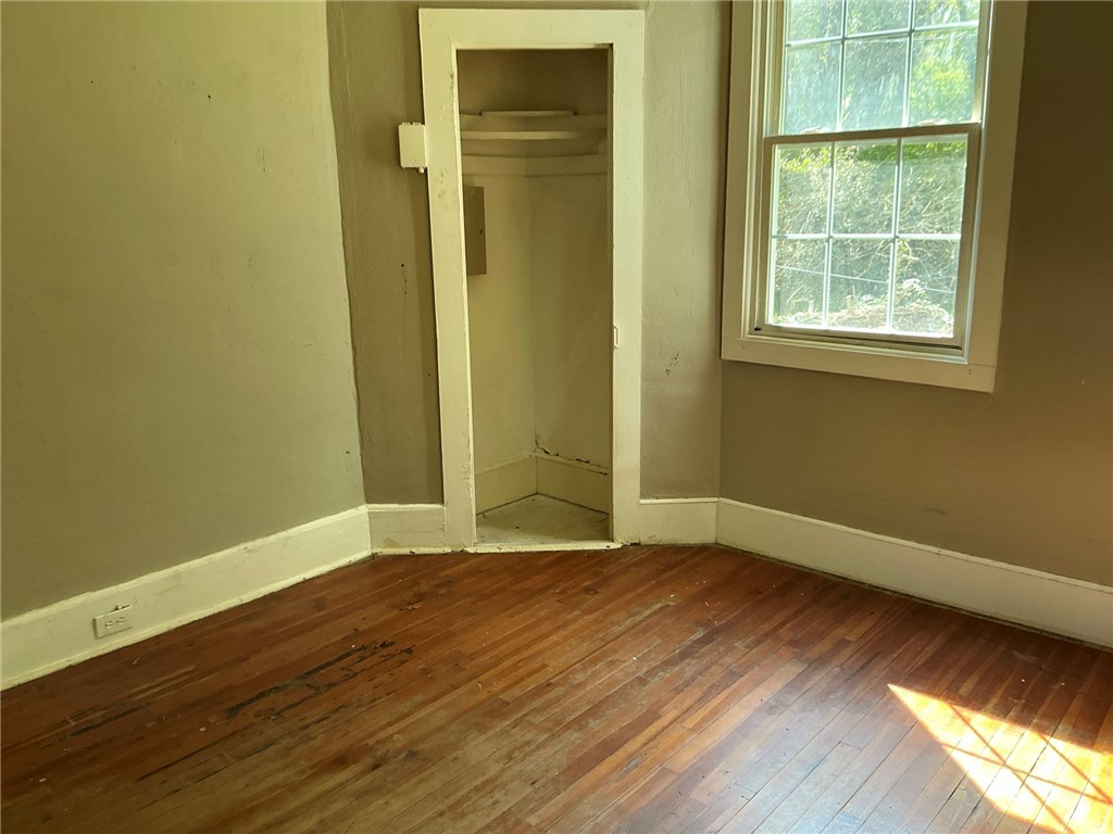 14 Ames Street Seneca, SC 29678 - Photo 11 of 16 This spacious room features hardwood floors, a closet, and ample natural light.