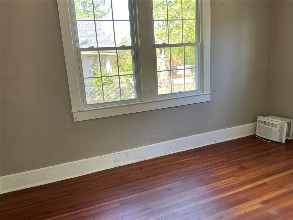 14 Ames Street Seneca, SC 29678 - Photo 3 of 16 This bright room features beautiful hardwood floors and a window offering natural light.