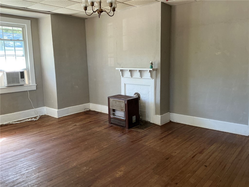 14 Ames Street Seneca, SC 29678 - Photo 4 of 16 This inviting space features hardwood floors and a classic fireplace, perfect for creating memorable moments.