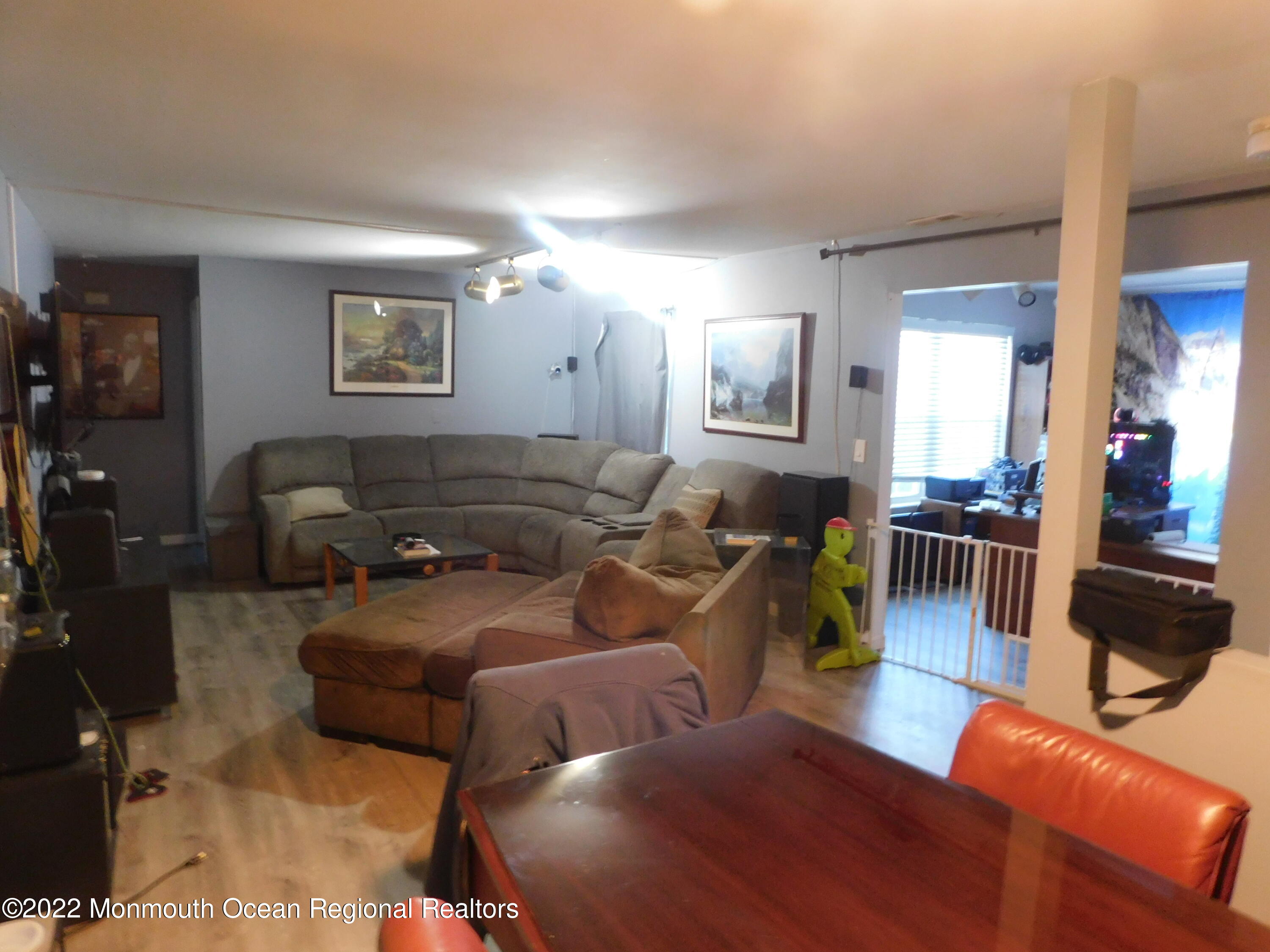 716 Zlotkin Circle, Unit 4 Freehold, NJ 07728 - Photo 4 of 10 a living room with furniture and wooden floor