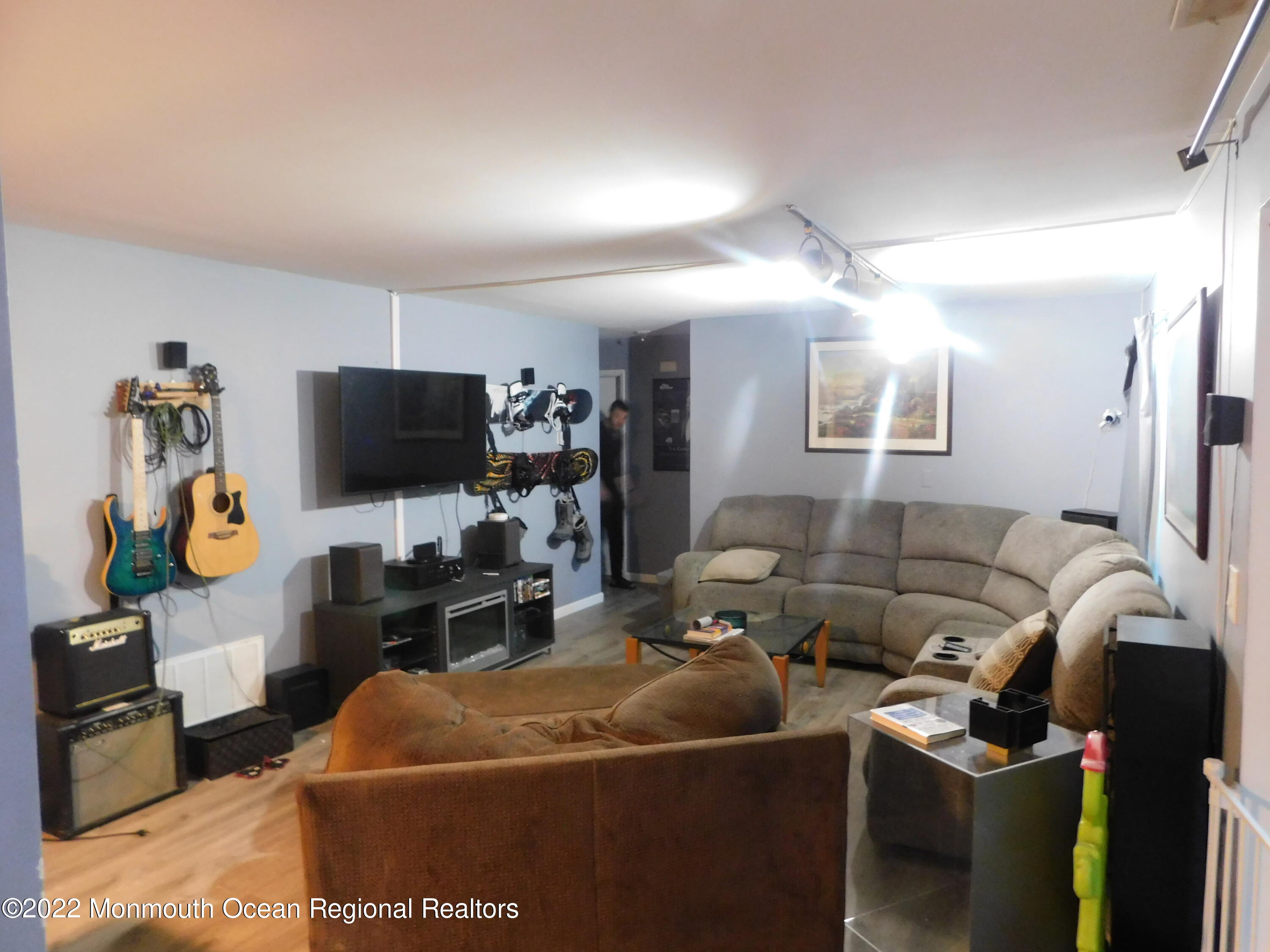 716 Zlotkin Circle, Unit 4 Freehold, NJ 07728 - Photo 5 of 10 a living room with furniture and a flat screen tv