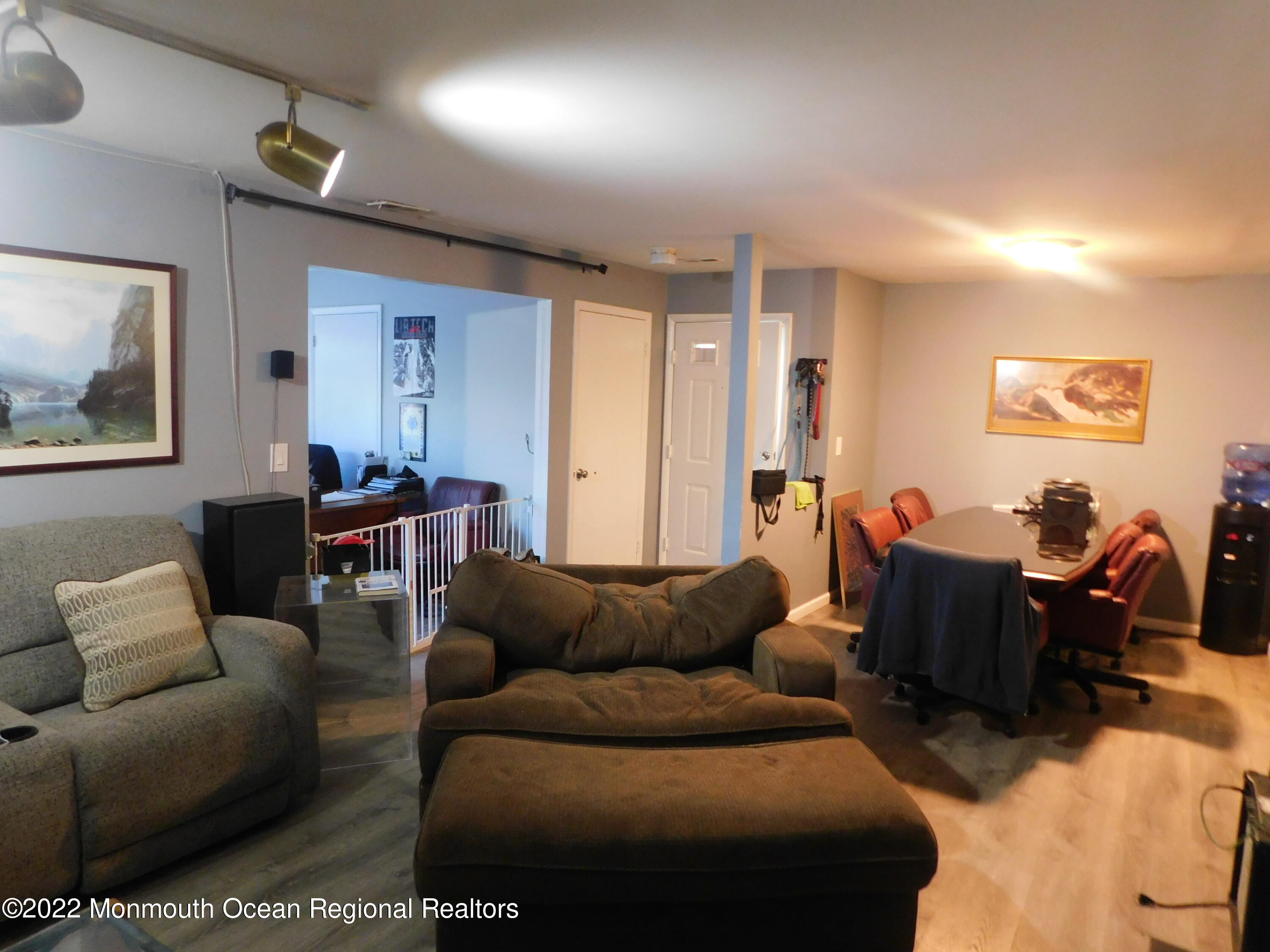 716 Zlotkin Circle, Unit 4 Freehold, NJ 07728 - Photo 9 of 10 a living room with furniture and a wooden floor