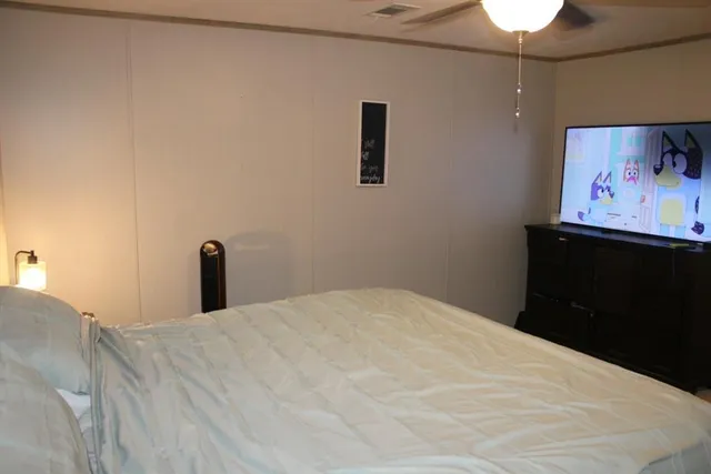 a bed room with a bed and a night stand