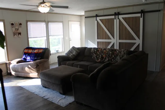 a living room with furniture and a window