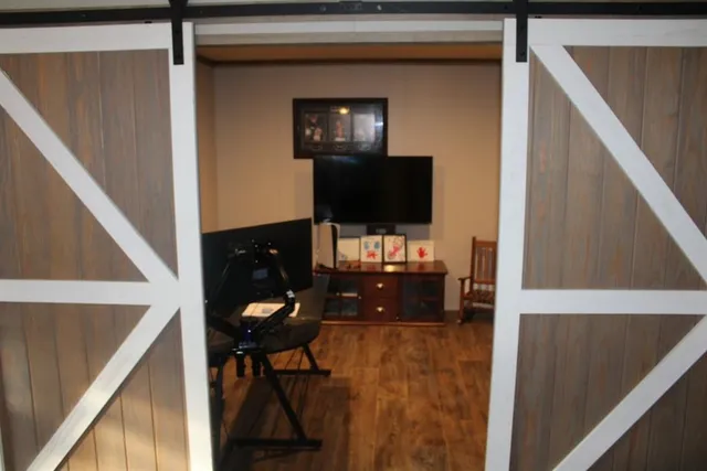 a living room with furniture and a flat screen tv