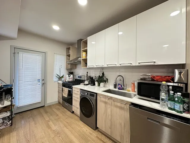 a kitchen with a stove and a refrigerator