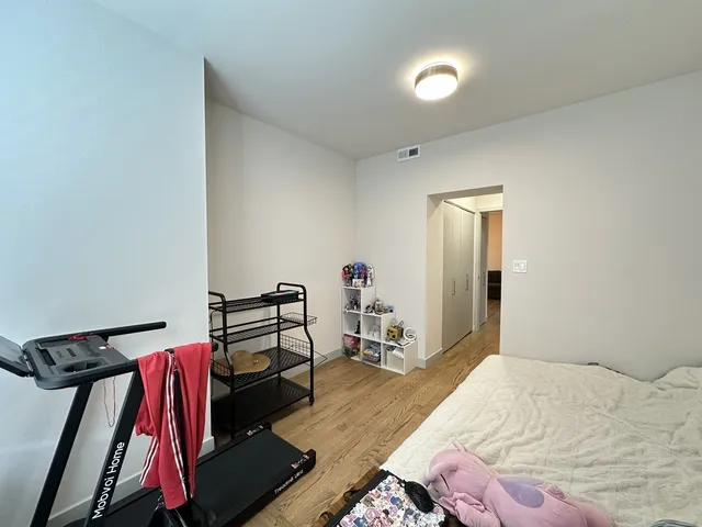 a bed room with a bed and a lamp