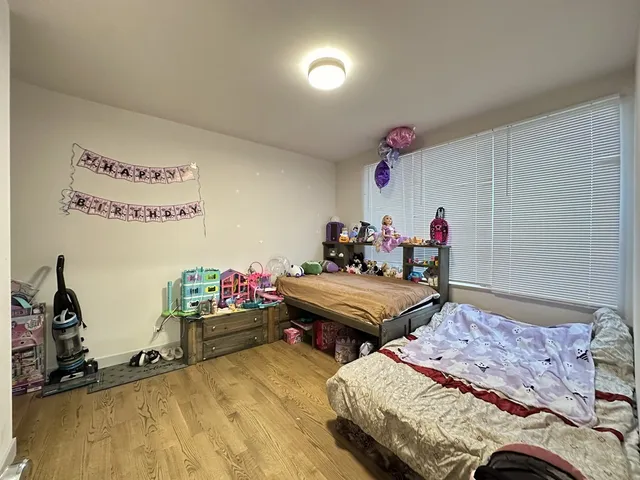 a bed room with a bed and a desk