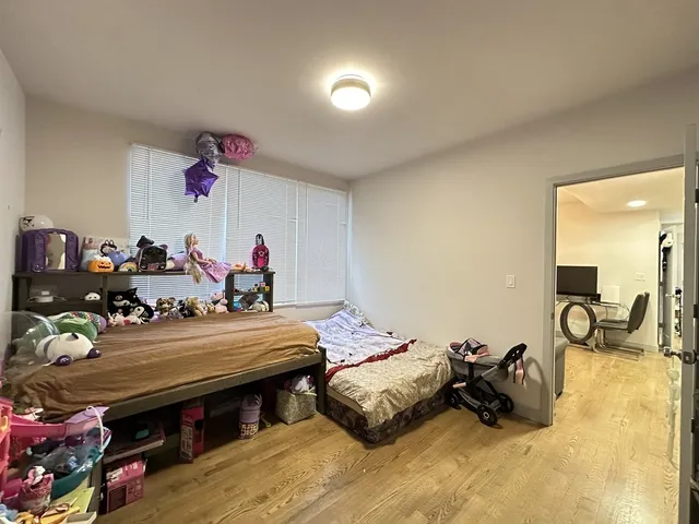 a bedroom with furniture and a chandelier
