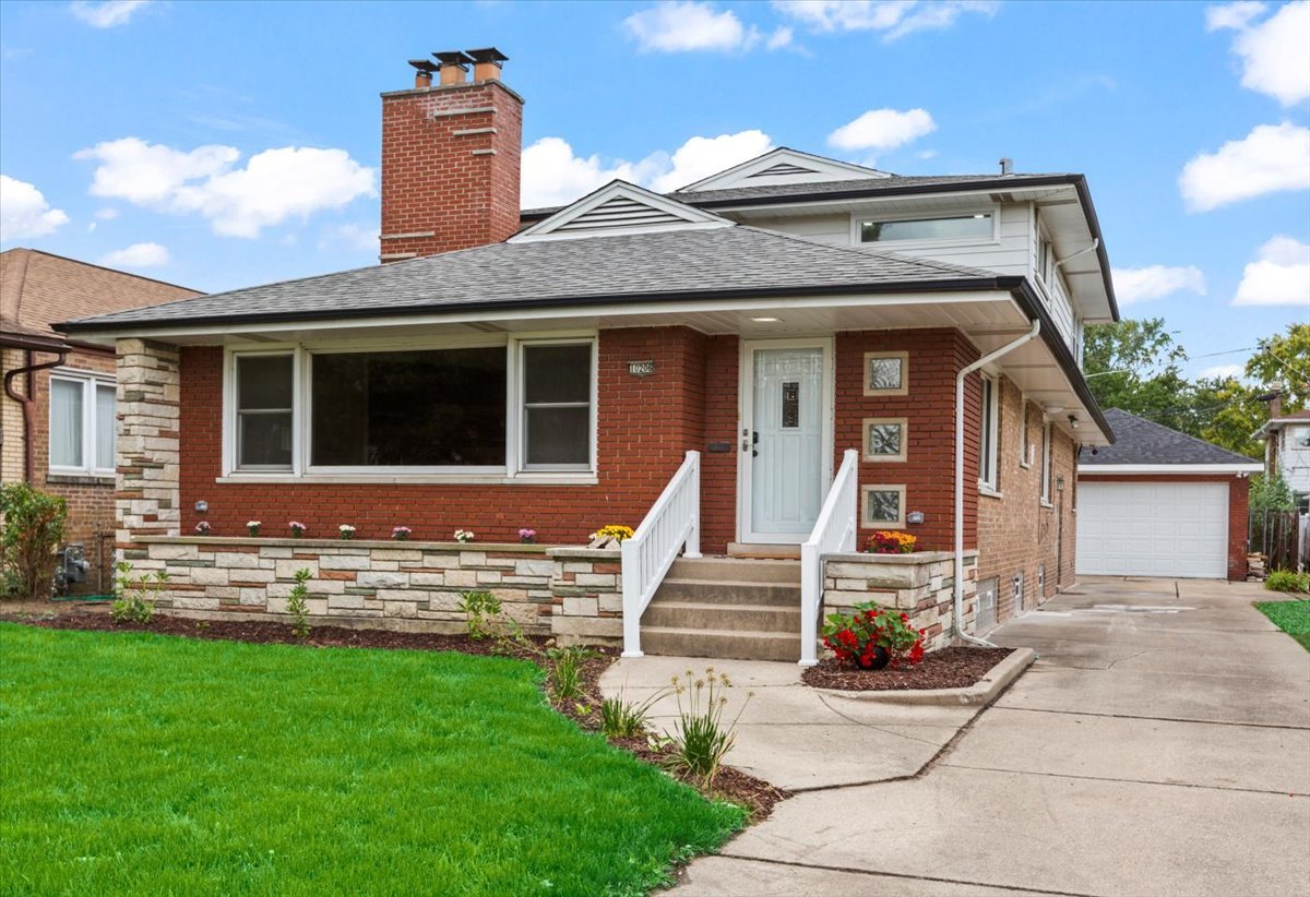 10206 South St Louis Avenue Evergreen Park, IL 60805 - Photo 1 of 33 a front view of a house with a yard