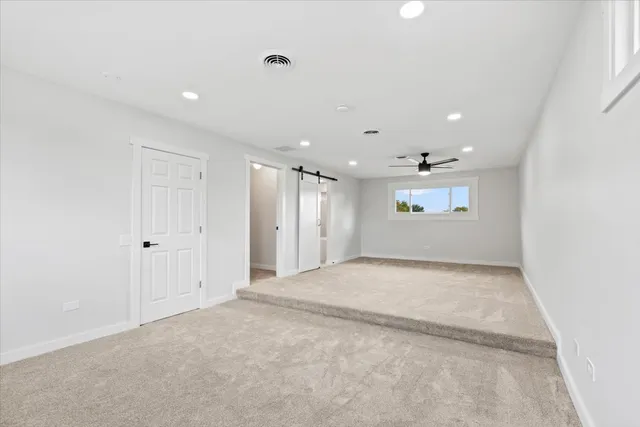 a bathroom with a double vanity sink mirror and toilet
