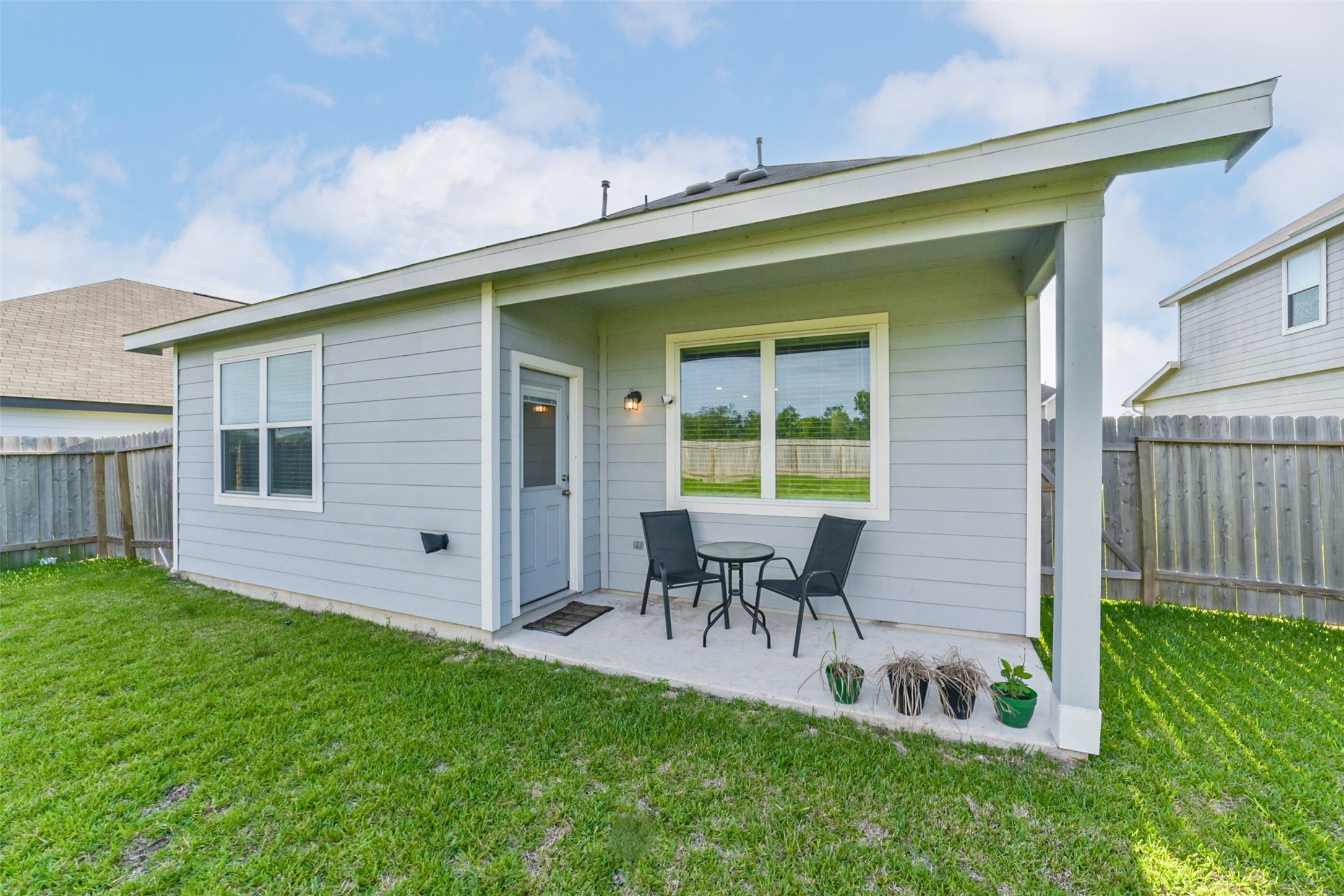 4907 Luke Matthew Drive Rosharon, TX 77583 - Photo 37 of 42 a backyard of a house with table and chairs