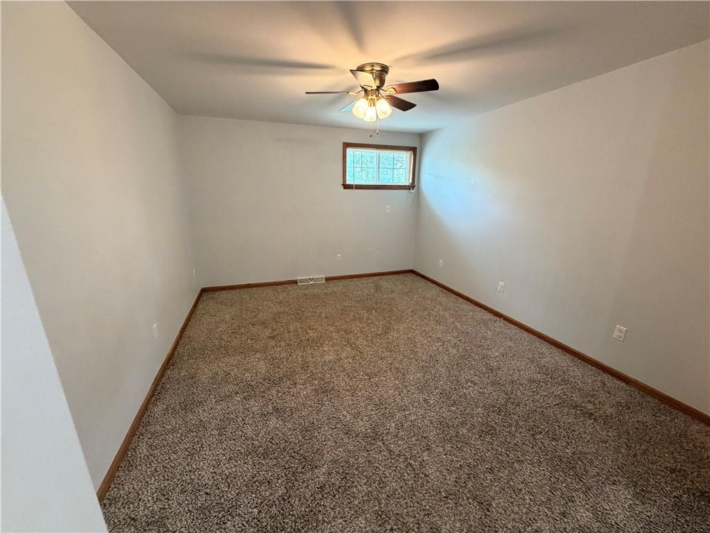 526 East River Road Edinburg, PA 16116 - Photo 29 of 45 an empty room with windows and fan