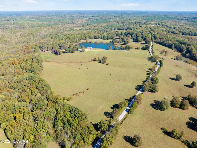 a view of a swimming pool with an outdoor space and seating area