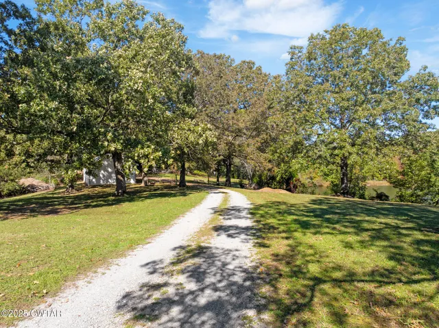 a outdoor space with patio furniture and kitchen view