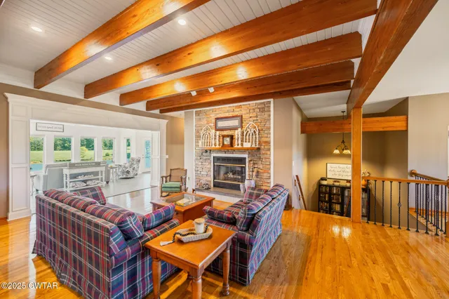 a view of living room with furniture and wooden floor