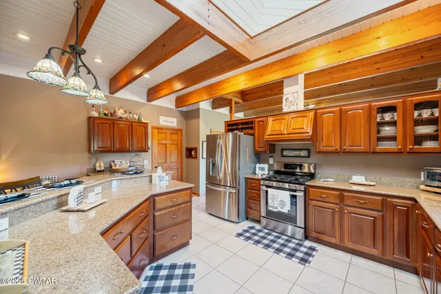 a bedroom with a bed and large window