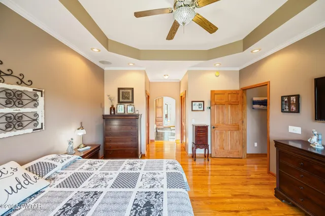 a view of a livingroom with furniture and a large window