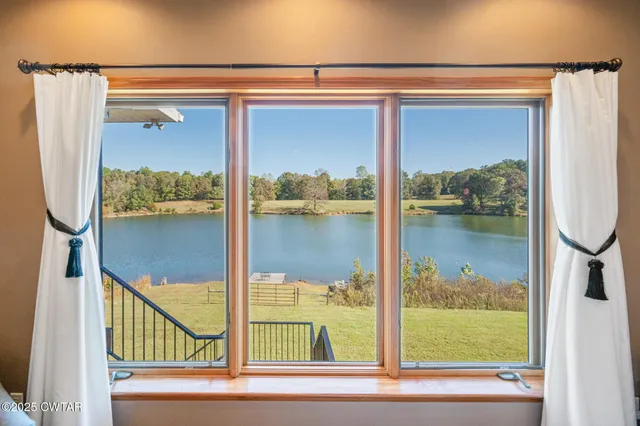 a living room with furniture ceiling fan and a rug