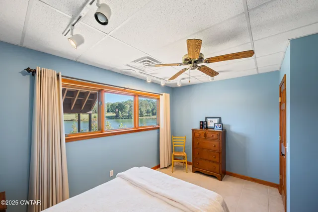 an aerial view of a house with a ocean view