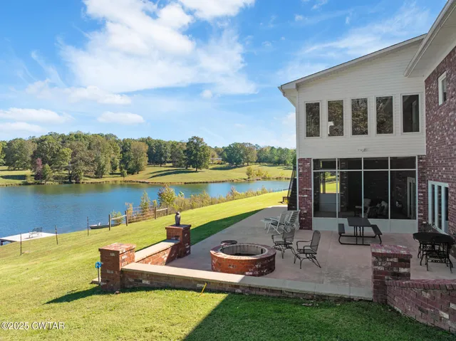 an aerial view of a house with a lake view