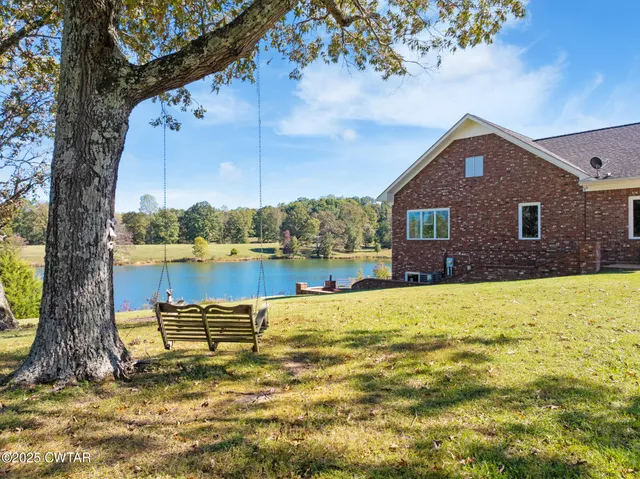 a view of a lake with a house in the background