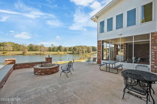 a view of a swimming pool with an outdoor seating