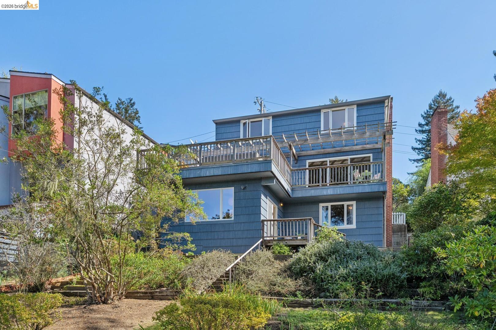 155 Avenida Drive Berkeley, CA 94708 - Photo 63 of 86 Multi-level dwelling with blue horizontal siding and multiple balconies