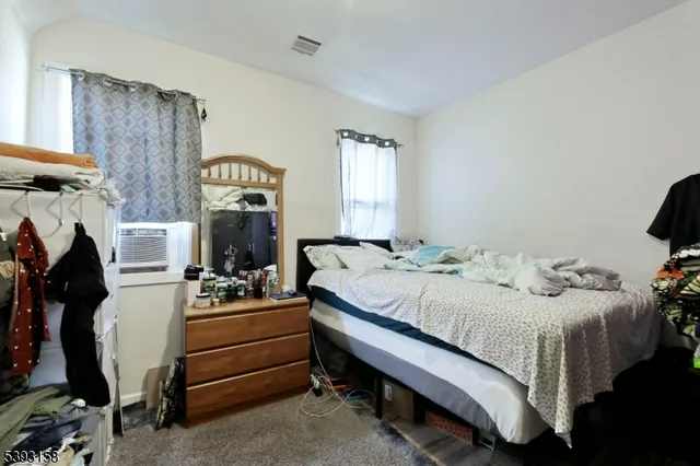 a bedroom with a bed and a table