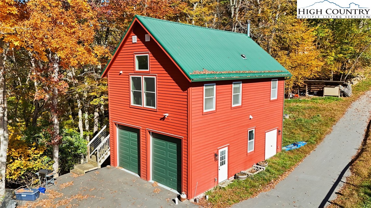 3242 Howard's Creek Road Boone, NC 28607 - Photo 1 of 33 a view of a house with a yard