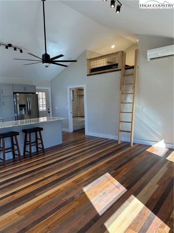 3242 Howard's Creek Road Boone, NC 28607 - Photo 11 of 33 a view of staircase and living room with wooden floor