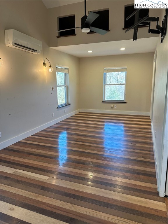 3242 Howard's Creek Road Boone, NC 28607 - Photo 18 of 33 a view of a room with wooden floor and staircase