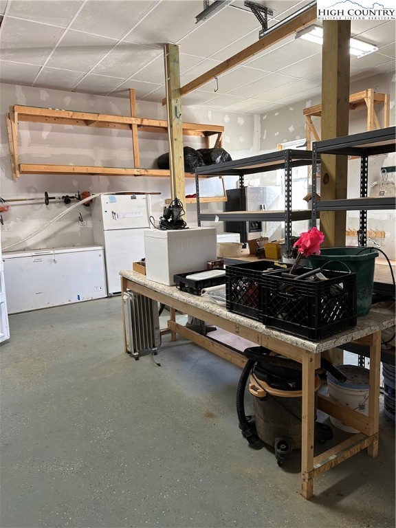 3242 Howard's Creek Road Boone, NC 28607 - Photo 23 of 33 a kitchen with stainless steel appliances kitchen island granite countertop a sink and cabinets